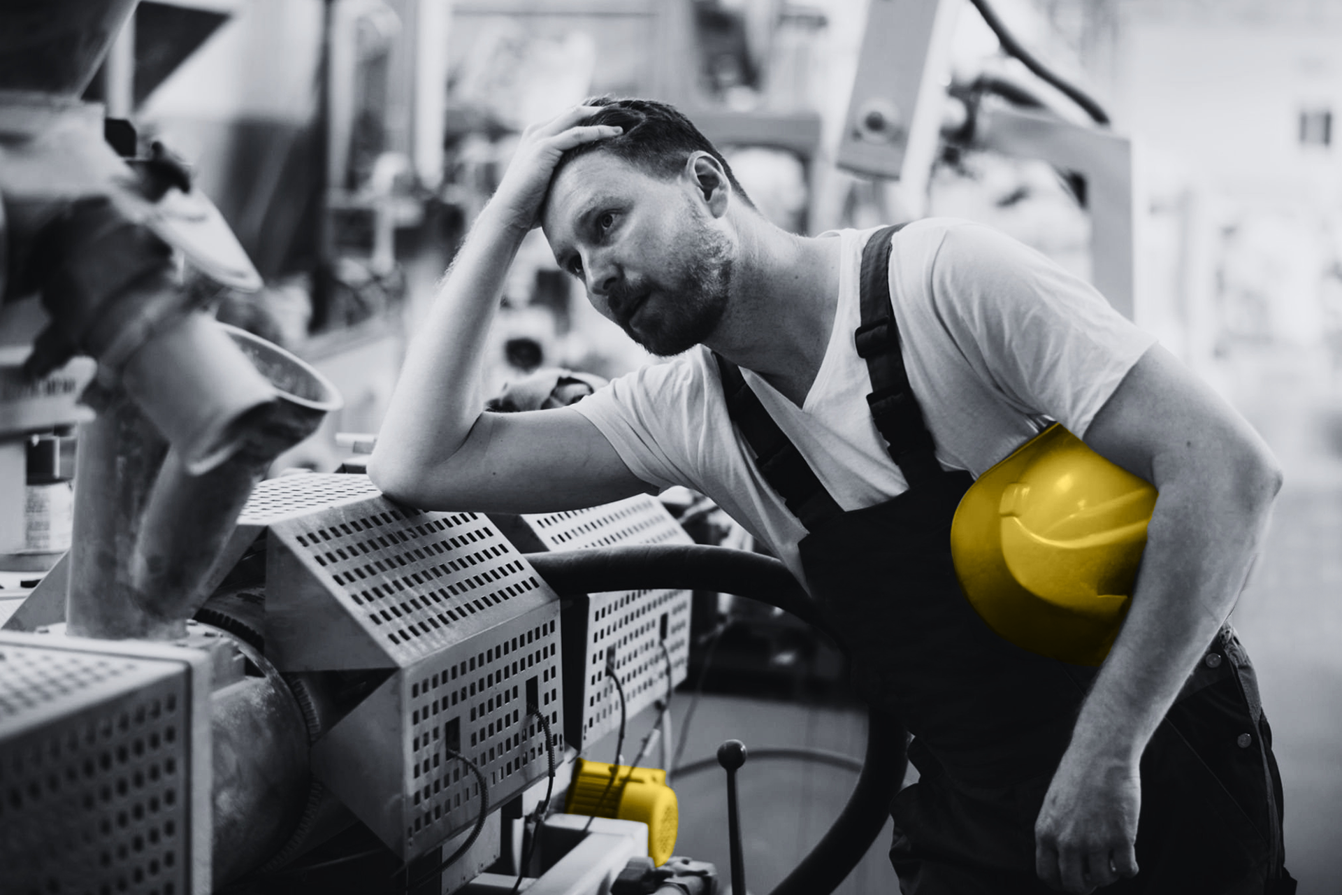 Industrial engineer inspecting machinery with safety helmet, representing reactive vs proactive automation sourcing and preventing downtime from obsolete parts
