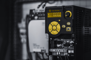 Allen Bradley industrial drive controller in control cabinet, representing legacy automation systems and obsolete PLC replacement for Siemens and Allen Bradley